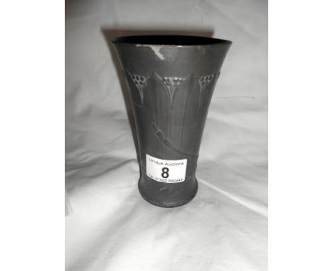 An art nouveau pewter vase