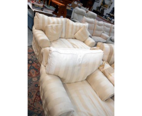 A cream striped sofa and chair