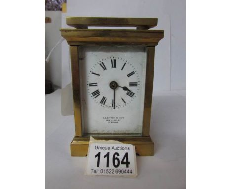 A brass carriage clock marked E Lenton & Son, 169, High Street, Clapham