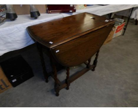 An oak barley twist gate leg table