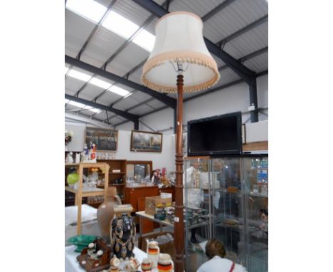 A standard lamp with shade