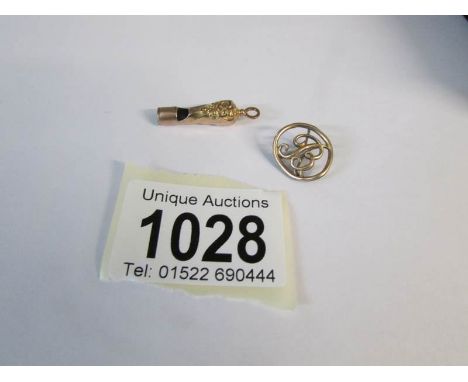 A pinchbeck dog whistle and one other item