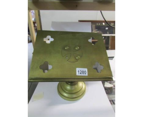 A brass book stand
