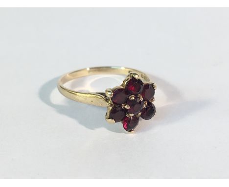 A 9ct gold garnet cluster ring, size K