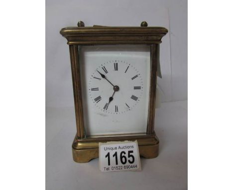 A brass carriage clock, back door a/f