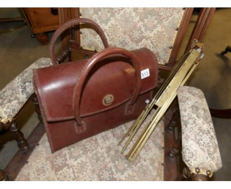 A case of old violin music and a music stand