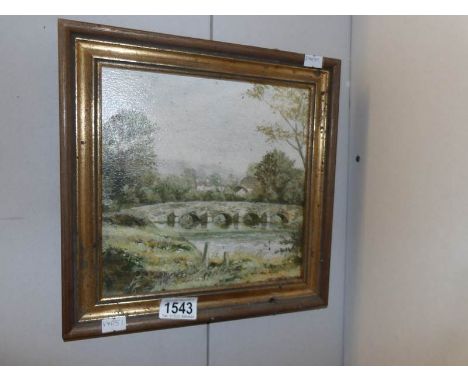 An oil painting of a rural village scene featuring a stone bridge over river signed Mike Knight