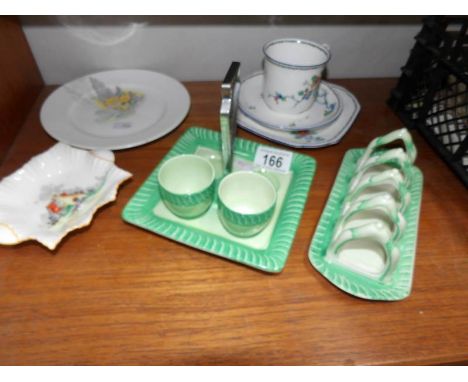 A Shelley toast rack, a trio, an egg cup stand (missing 2 egg cups), a plate and a pin tray