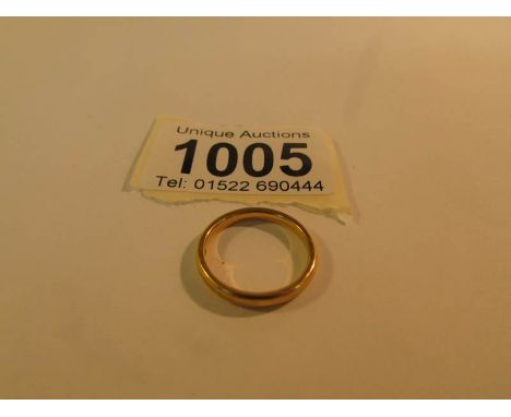 A 22ct gold wedding band, size K, approximately 3 gms