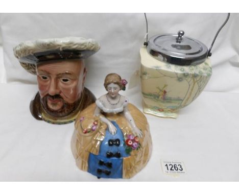 A Henry V111 character jug, a biscuit barrel and a crinoline lady trinket pot