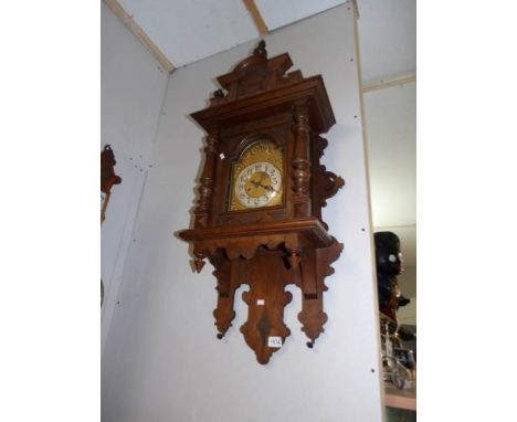 An oak wall clock