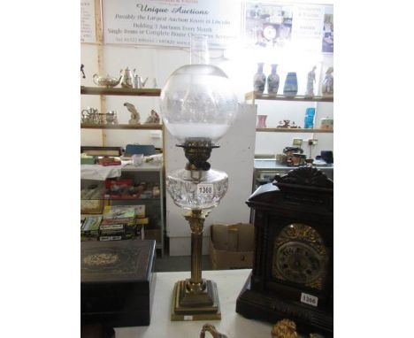 A Corinthian column oil lamp with glass font and later shade