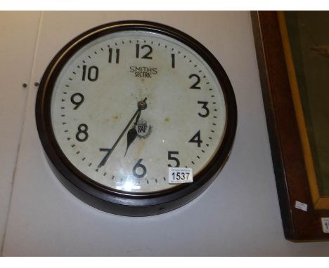 A Smith's bakelite sectric R.A.F wall clock with later quartz battery movement