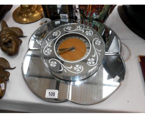A mirrored wall clock