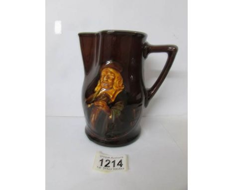 A Royal Doulton series ware motto jug inscribed 'It is hard for an empty bag to stand upright'