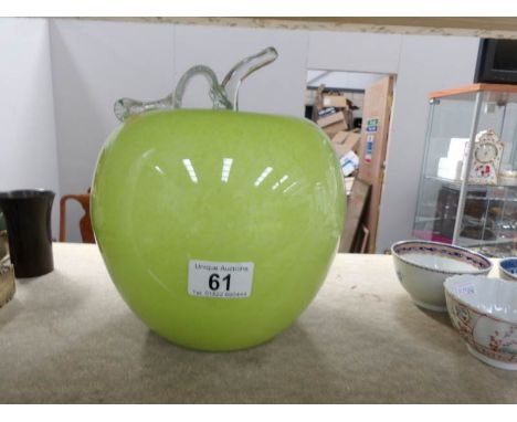 A large glass apple paperweight by Rooster art glass