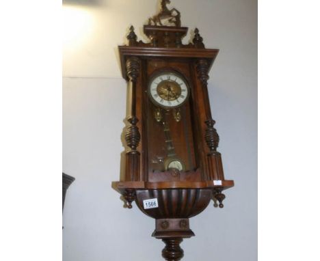 A mahogany wall clock