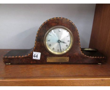 A walnut mantel clock