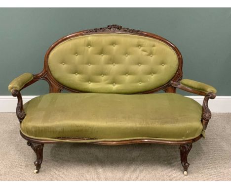 VICTORIAN WALNUT FRAMED SALON COUCH, button upholstered oval cameo back, carved crest rail, swept shape arms, knurled feet, w