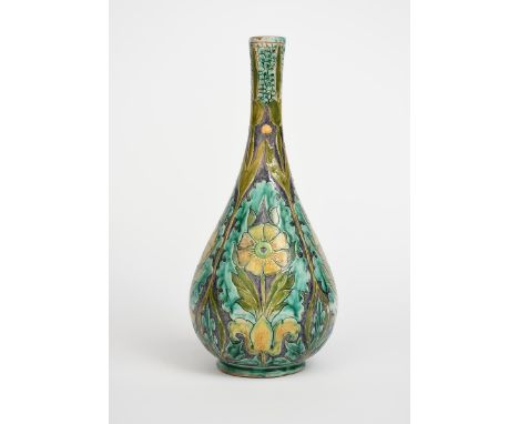 A Della Robbia Pottery vase by Hannah Jones and Charles Collis, slender bottle form, incised with stylised flower and foliage