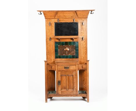A Liberty &amp; Co oak hallstand, rectangular with flaring over-mantel top, the back inlaid with copper and green ceramic til