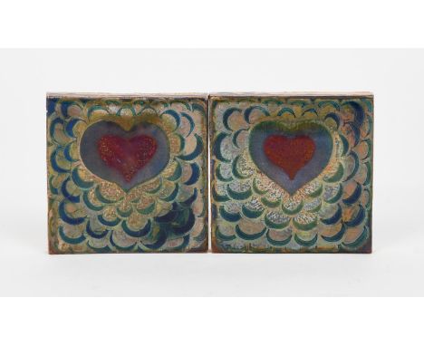 A pair of Pilkington's Lancastrian tiles,  each painted with a simple heart motif on scale ground, in blue, red and golden lu