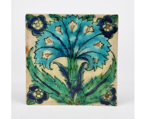 A Pilkington's Lancastrian Persian  tile probably designed by John Chambers, painted and tubeline decorated with central flow