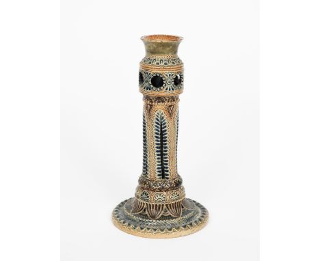 An early Martin Brothers stoneware candlestick by Robert Wallace Martin, dated 1875, stepped circular base supporting cylindr