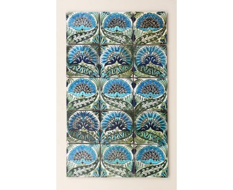 A William De Morgan Mongolian fifteen tile Persian panel, each tile with a single flower motif, painted in shades of blue, gr