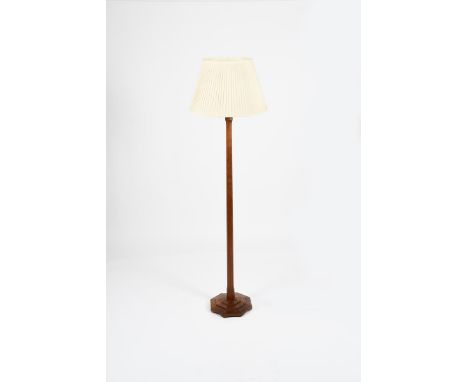 An Edward Barnsley walnut floor lamp,  stepped, octagonal base supporting tapering octagonal column, with modern white shade,