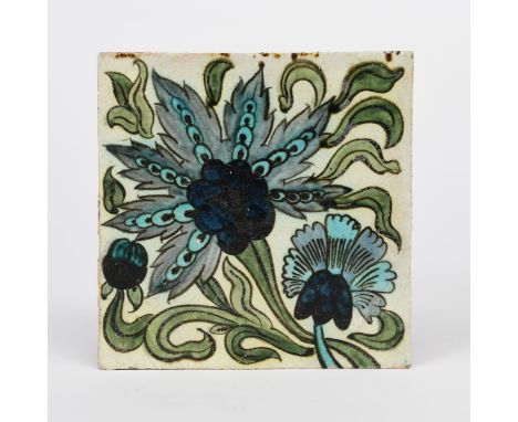 An early William De Morgan  Persian Chelsea Period Roumelian tile,  painted with stylised flowers and foliage in shades of bl