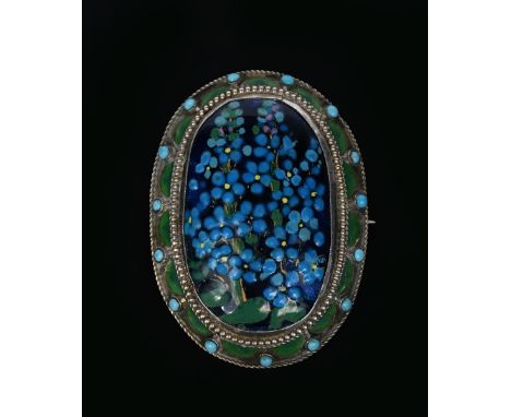 A silver and enamel brooch by George Hunt,  dated 1925, the oval frame with central forget me not enamel inside rope borders 