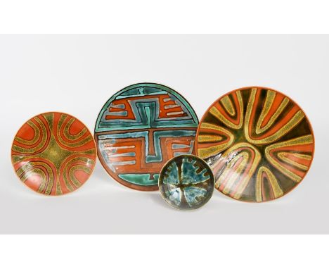 A Poole Pottery Studio  plate, shape no.4, painted with abstract horseshoe design in shades of orange and green, another smal