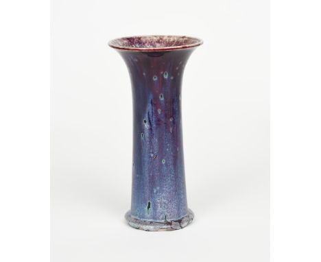 A Ruskin Pottery high-fired stoneware vase designed by William Howson Taylor, dated 1926, cylindrical form with flaring rim, 