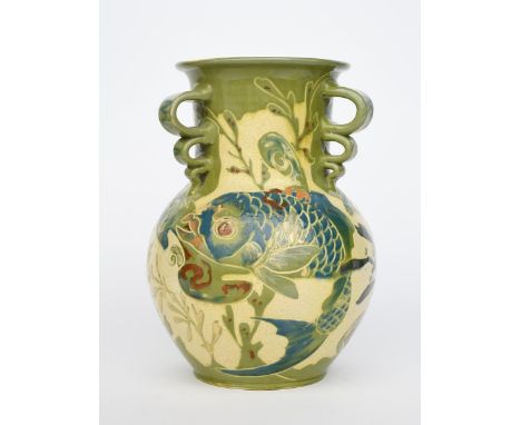 A large C H Brannam Pottery vase by James Dewdney, dated 1894, ovoid with cylindrical neck, the neck applied with three loope