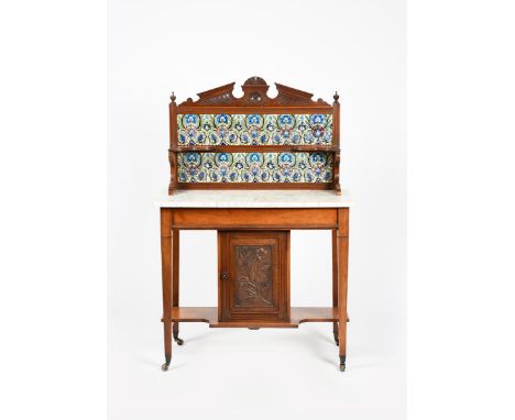 A mahogany and marble topped washstand inset with William De Morgan tiles,  tapering square legs with casters, central cupboa