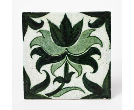 A William De Morgan Merton Abbey Period tile, painted with a foliage design in green on a white ground, impressed factory mar