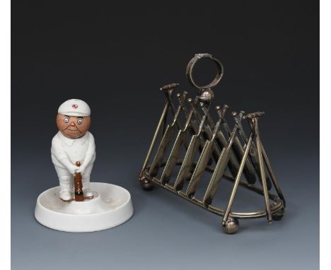 A bisque porcelain model of a cricketer designed by John Hassall,  modelled in whites and cap holding his bat, head loose, on