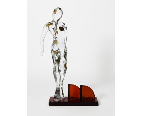 ‡ Renato Anatra (born 1943) Standing female figure Murano glass, clear glass figure with applied gold lead patches, on red gl