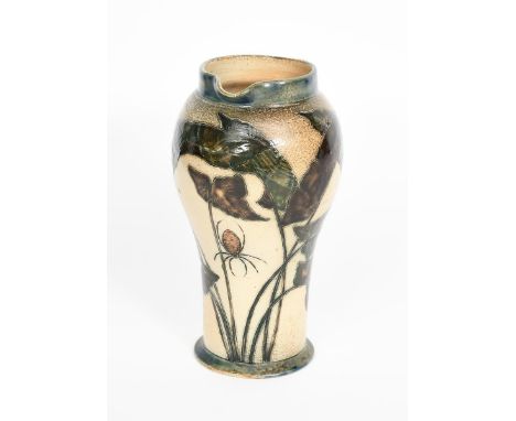 A Martin Brothers stoneware jug by Robert Wallace Martin, swollen cylindrical form, incised with a spider hanging from a larg