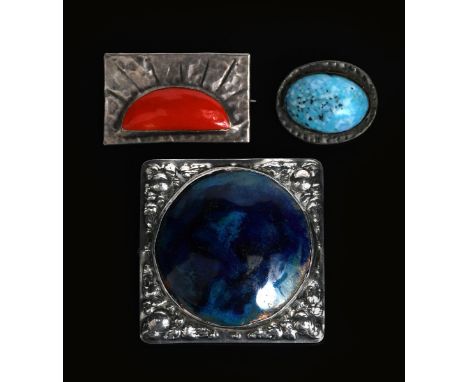 A George Hunt pewter and enamel brooch, square section cast in low relief with foliate design, central large blue enamel ston