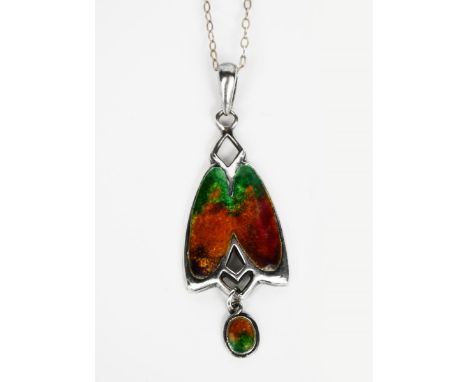 A William H Haseler silver and enamel moth pendant,  modelled as a stylised moth enamelled green and orange, with circular en