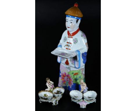 A Chinese figure group, of a gentleman in flowing robes holding dish, florally polychrome decorated predominately in pink, gr