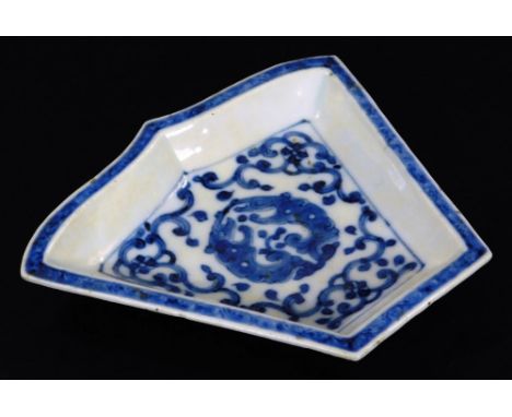 A Chinese porcelain asparagus dish, of shaped form, centred with a disc with outer scroll border and blue and white banding, 