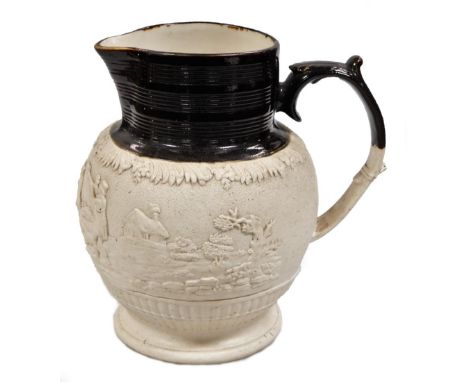 A late 18thC D D &amp; Co Castleford pottery jug, with ribbed top, moulded handle and shaped body raised with figures of rifl