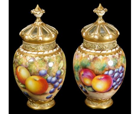 A pair of 20thC Royal Worcester porcelain fruit pattern potpourri vases, covers and liners, by Richard Lewis and P Lynes, eac