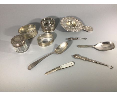 A small collection of assorted silver items comprising an import silver tea strainer by Samuel Boyce (or Boaz) Landeck, and a