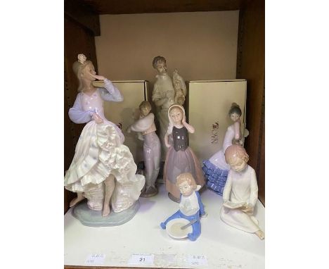 A Lladro porcelain figure '4763 The Obstetrician', together with six assorted NAO porcelain figures including a small child e