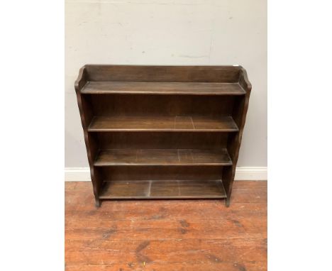An Edwardian 4 shelf floor standing open book case in dark solid oak 91cm wide, 19cm deep, 94cm high 
