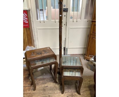 A nest of four carved oak tables depicting Chinese landscapes together with a matching lamp stand (af) 